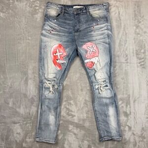 Men's Distressed Light Blue Jeans with Red Graphic Knees